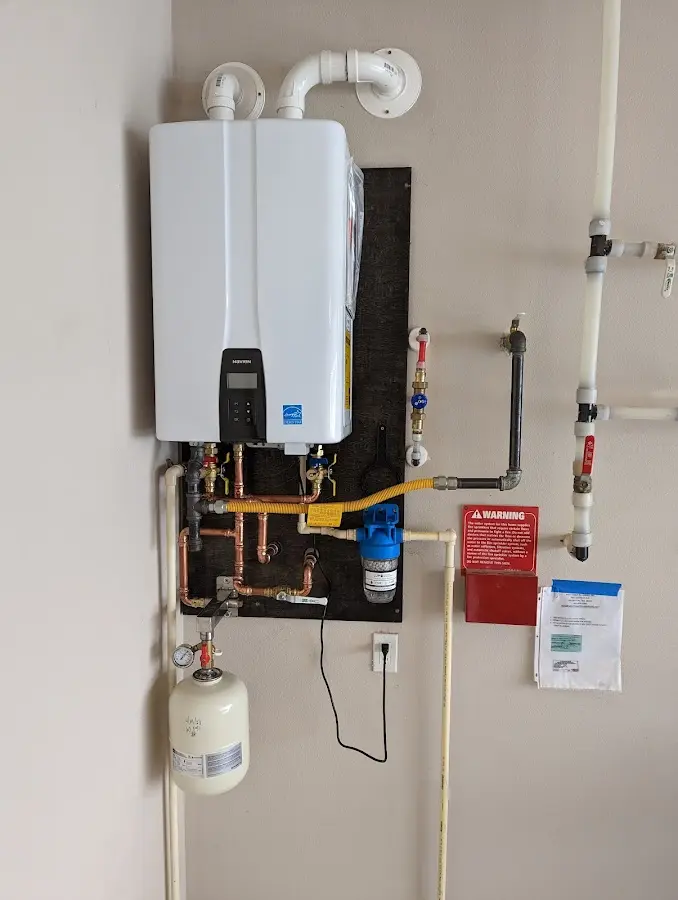 Professional plumber installing copper piping in a Middletown home